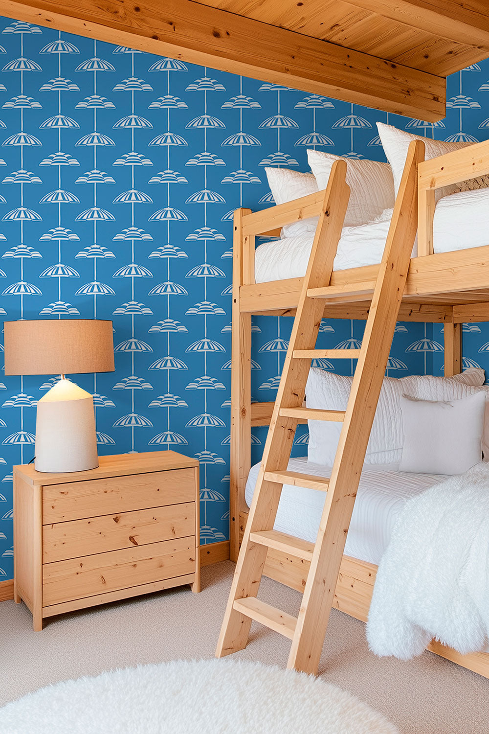 custom performance vinyl wallpaper that is washable and moisture repellant in bold pretty royal blue and white beach umbrella stripes for interior designers and custom home builders of coastal beach homes, great for kids bedrooms and bunk rooms