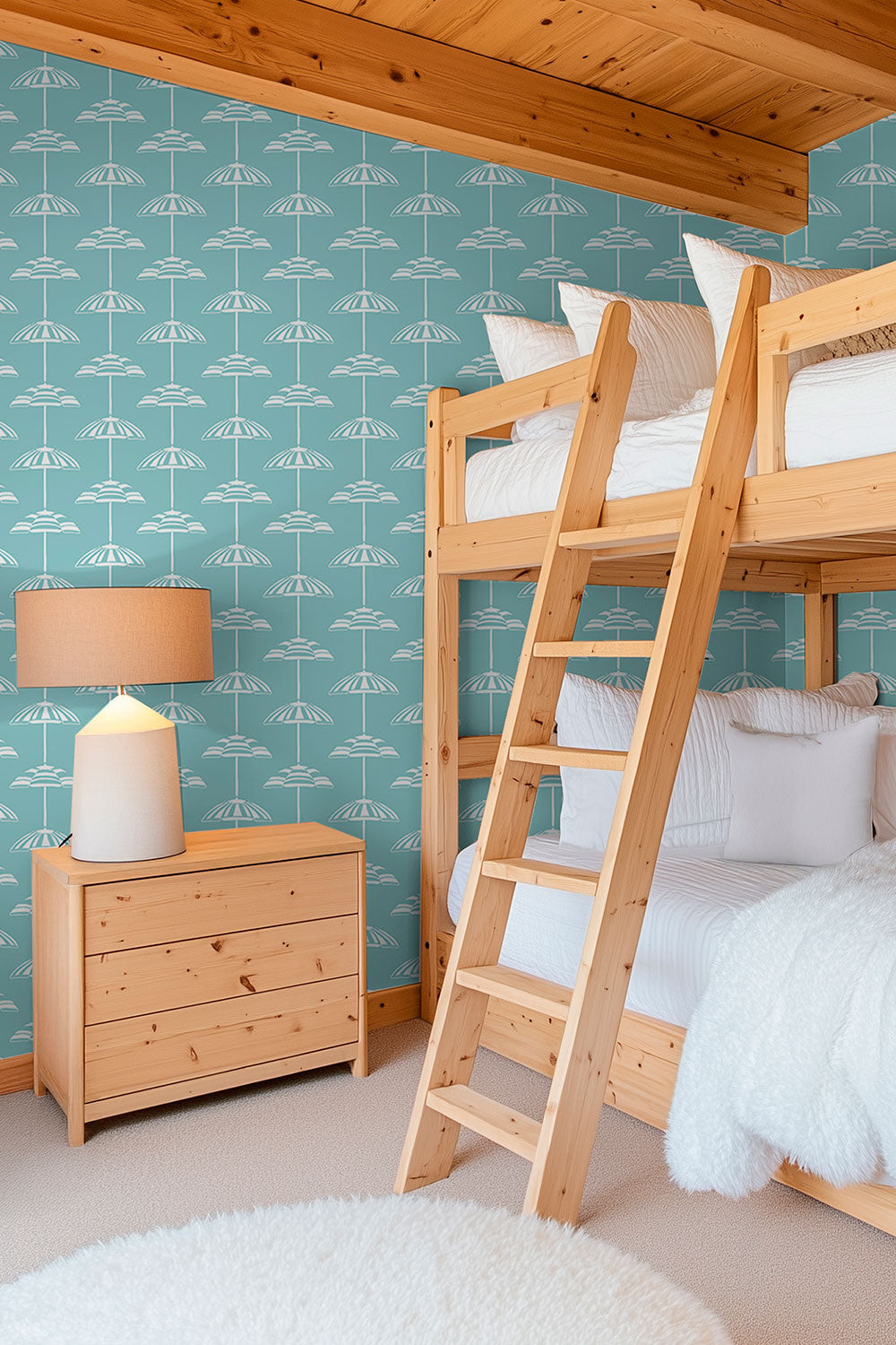 coastal beach house kids bunk room with hand-drawn watercolor beach umbrella striped gender neutral teal green wallpaper
