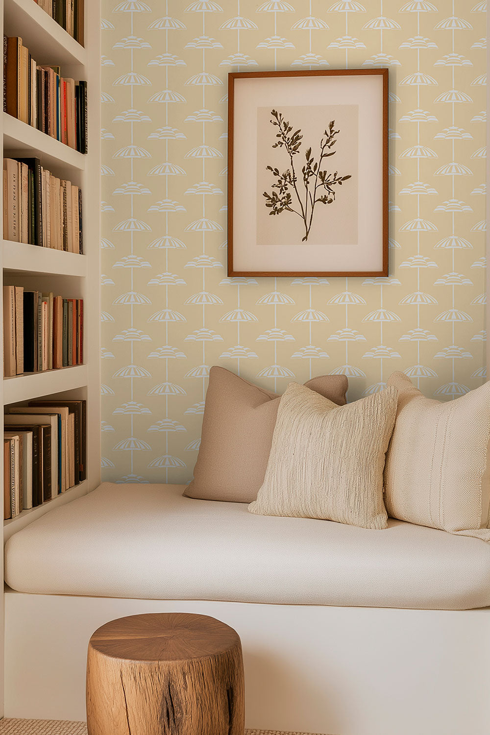 reading nook in modern coastal home with hand-drawn beach umbrella striped wallpaper in natural colors