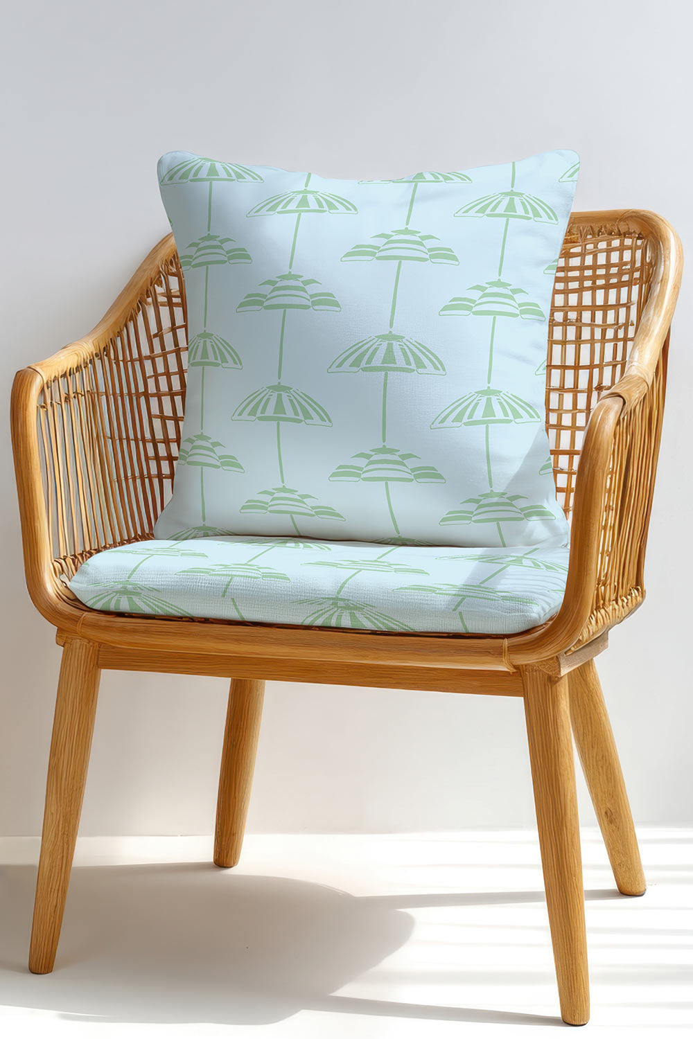 Hand-drawn vertical cabana stripe upholstery fabric inspired by beach umbrellas, shown in a coastal color palette with a classic yet playful look.