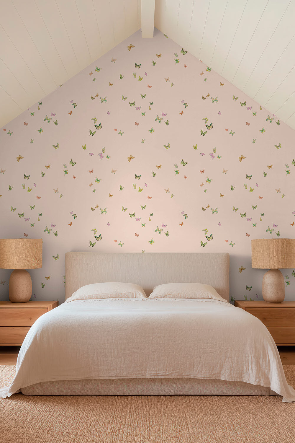 Butterfly Grove wallpaper featuring watercolor-painted butterflies in soft pink, green, and neutral tones inspired by English garden skies perfect for cozy guest bedrooms