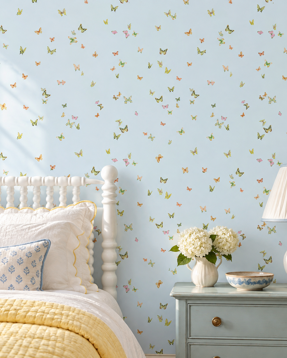 Butterfly Grove wallpaper featuring watercolor-painted butterflies on light sky blue with soft pink, green, and neutral tones inspired by English garden skies perfect for feminine bedrooms