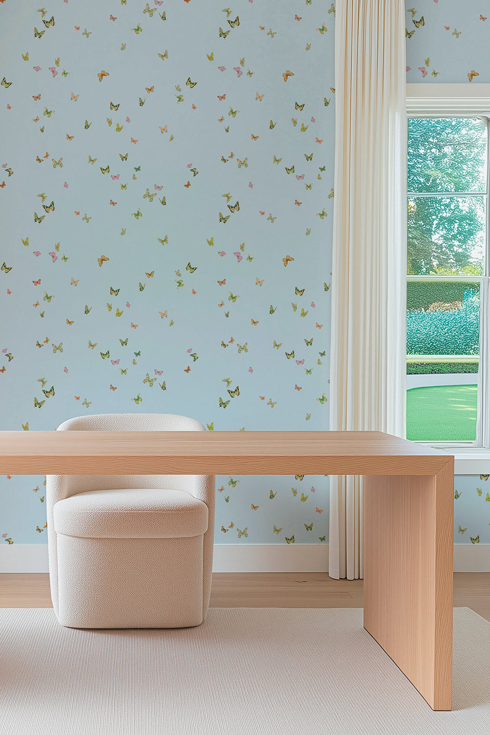 Butterfly Grove wallpaper featuring watercolor-painted butterflies on light sky blue with soft pink, green, and neutral tones inspired by English garden skies perfect for feminine home offices