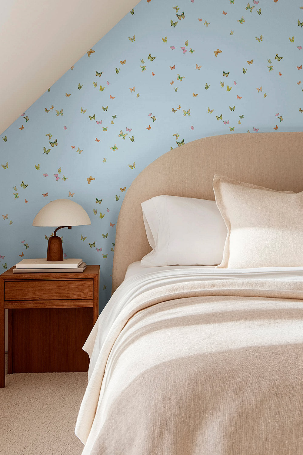butterfly grove all-natural and eco-friendly grasscloth and basketweave wallpaper features watercolor-painted butterflies in soft blue with green, and neutral tones inspired by English garden skies perfect for cozy cottage guest bedrooms