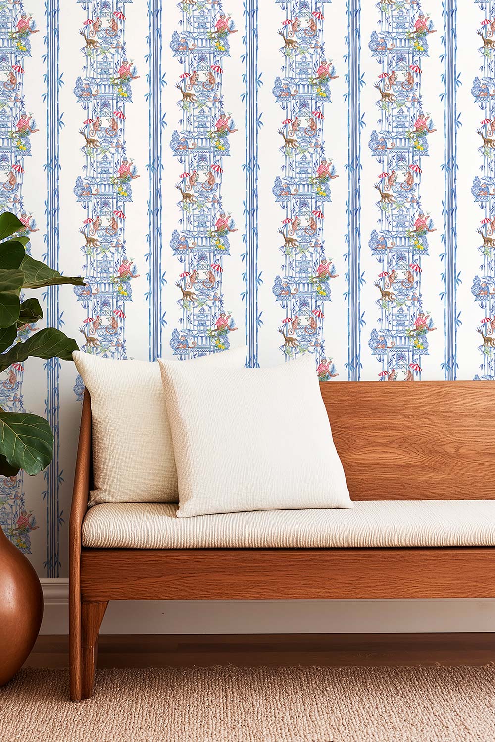 Hand-painted chinoiserie toile wallpaper featuring monkeys partying in pagodas, bamboo stripe details, and classic chintz-inspired motifs; shown in traditional blue colorways, perfect for entrances and dining rooms