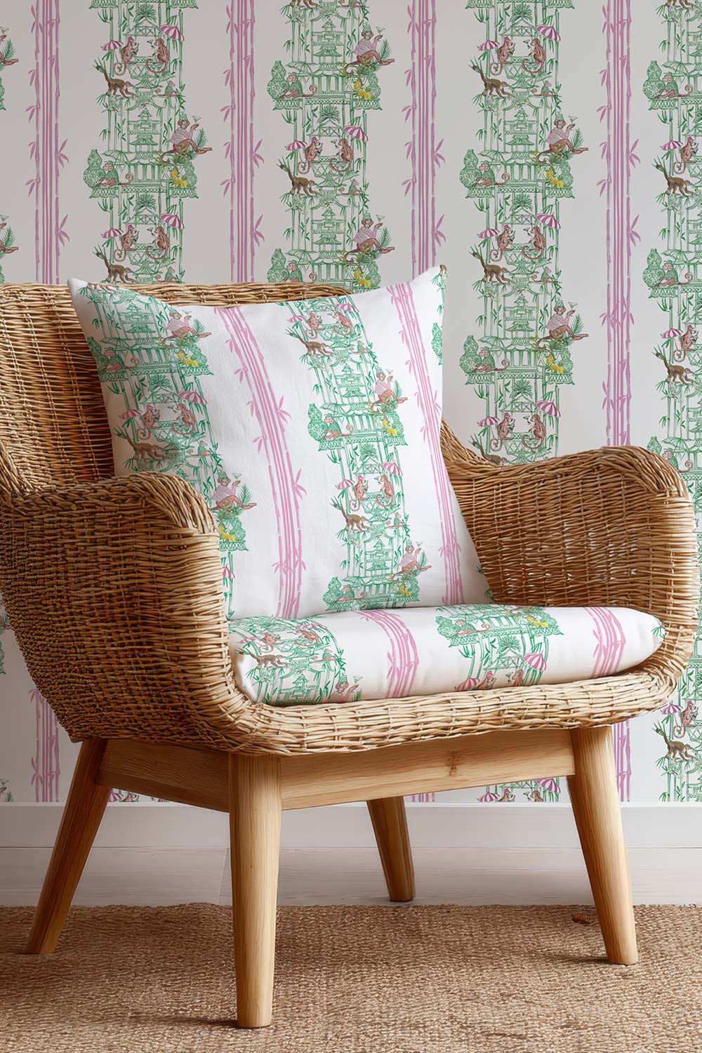 Whimsical chinoiserie toile upholstery fabric featuring pagodas, bamboo details, and monkeys partying in a hand-painted striped layout.