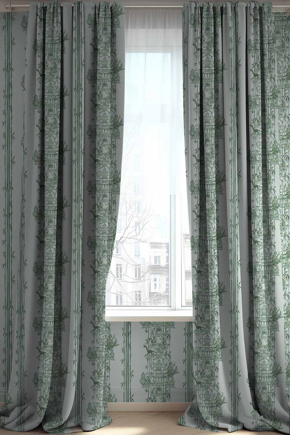 Whimsical chinoiserie toile upholstery fabric featuring pagodas, bamboo details, and monkeys partying in a hand-painted striped layout.