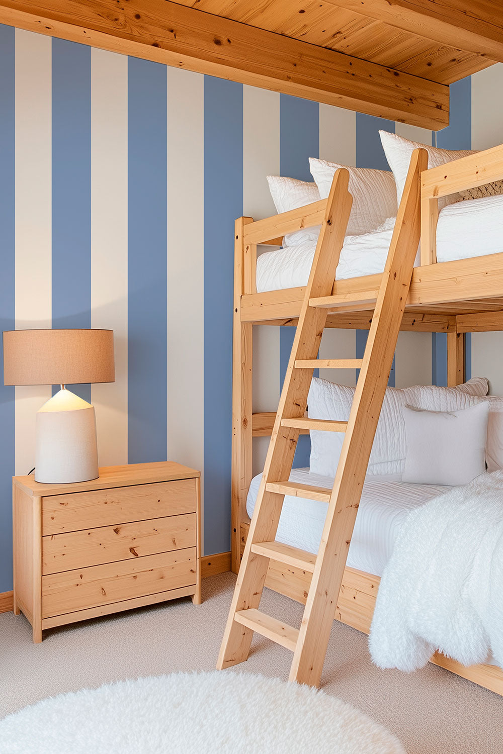Modern mountain vacation house kids bunk room with clean and modern 2-color luxury striped classic blue and white traditional wallpaper.
