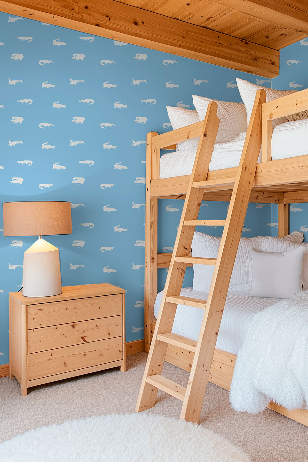 beach house bunk room with fun blue and white coastal crocodile wallpaper design