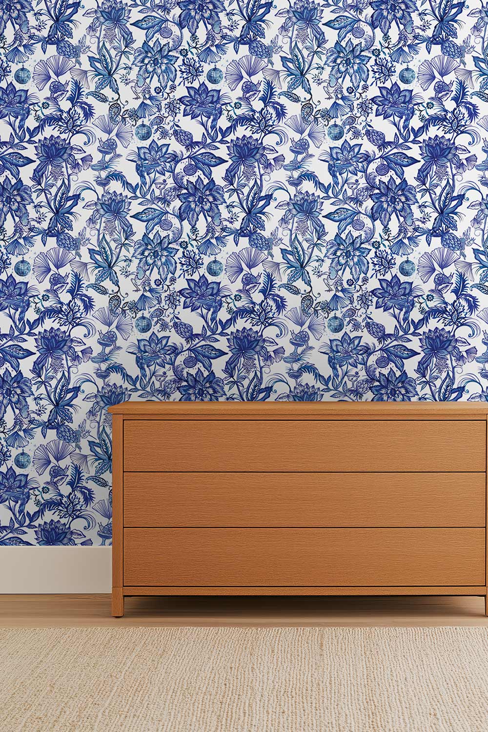 Hand-painted chinoiserie floral wallpaper on natural grasscloth featuring dancing frogs, snails, hummingbirds, and botanical details in a whimsical pattern perfect for luxury bedrooms