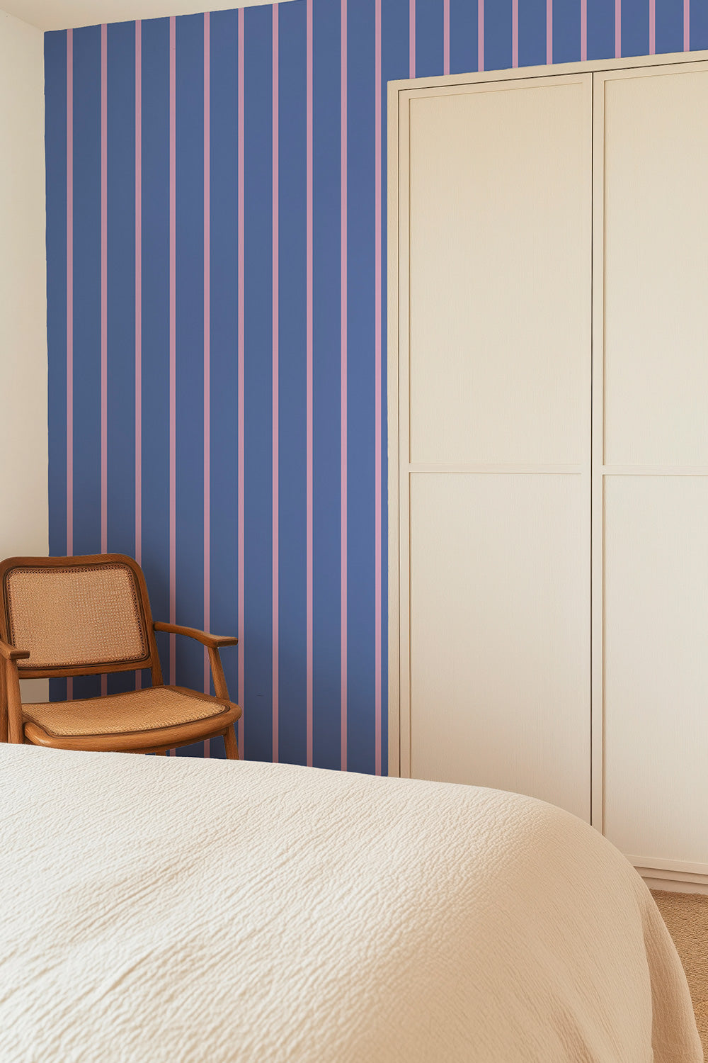 fun pinstriped wallpaper in pops of periwinkle and purple that bring life and fun to happy spaces