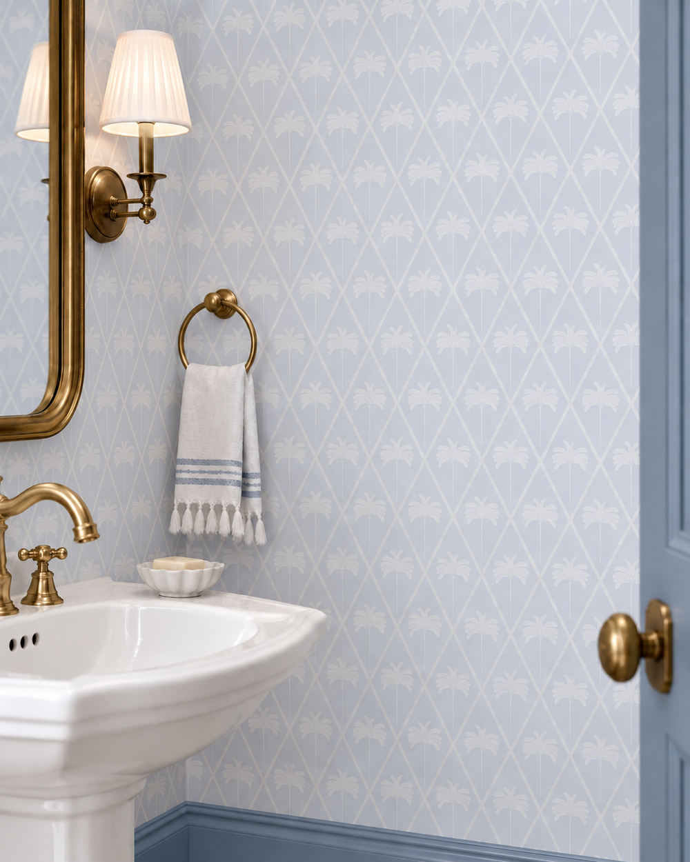 washable and stain resistant performance vinyl wallpaper in french blue lattice design with geometric hand drawn palm trees for coastal homes seen here in this luxury guest bathroom