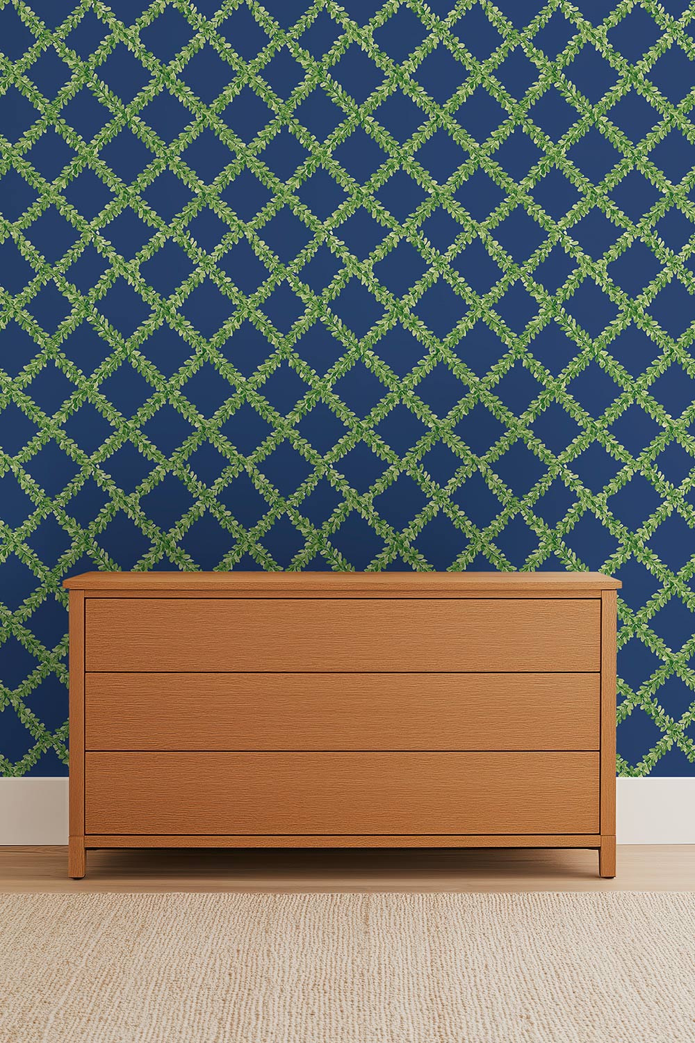 Ivy Trellis grasscloth wallpaper featuring hand-painted green leafy diamonds on a bright navy blue woven natural fiber surface