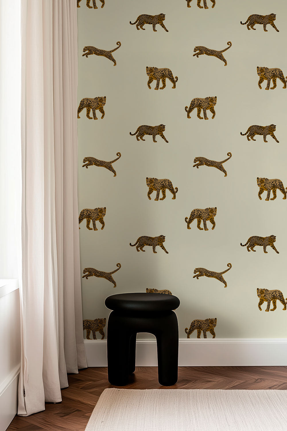 Leopard animal print wallpaper styled in a bold, modern interior setting