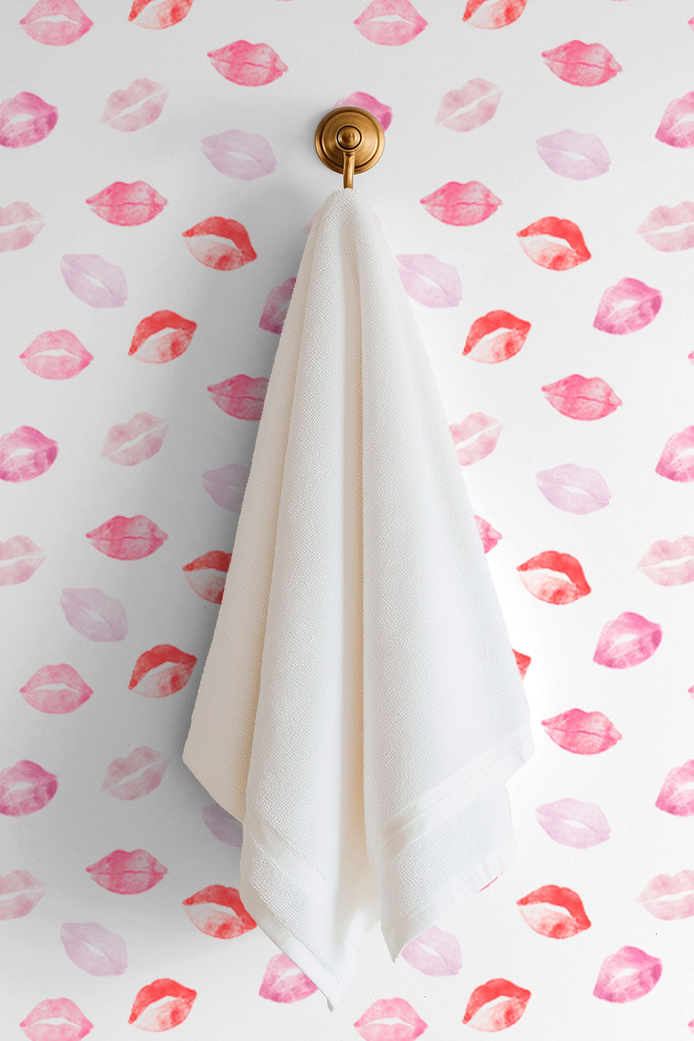 Durable textured vinyl wallpaper with repeating watercolor lipstick kiss marks in pink and red hues perfect for girl's bedrooms, bathrooms and beauty salons and makeup studios