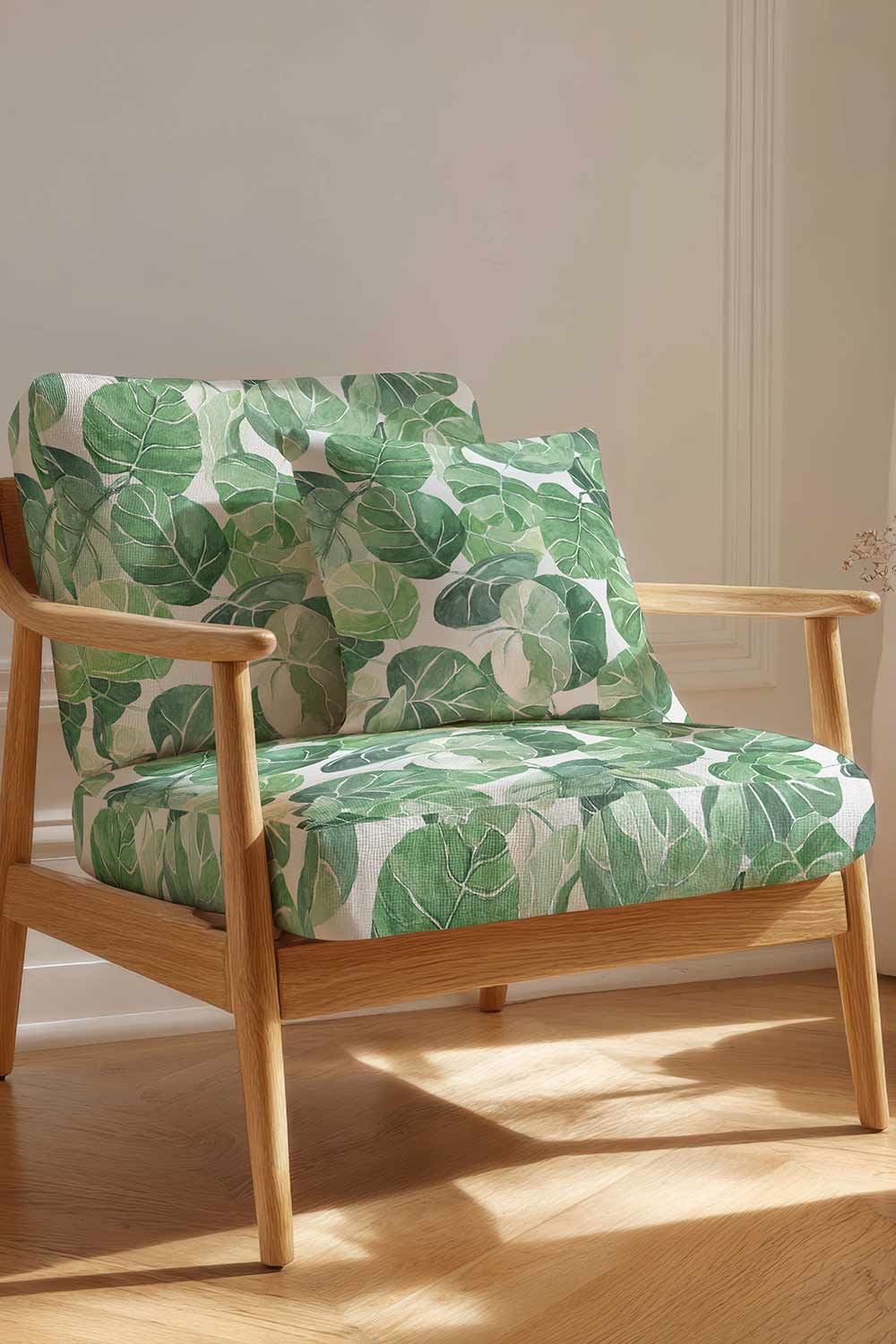 Tropical botanical upholstery fabric with large-scale hand-painted watercolor leaves in layered shades of green, inspired by coastal landscapes on white base.