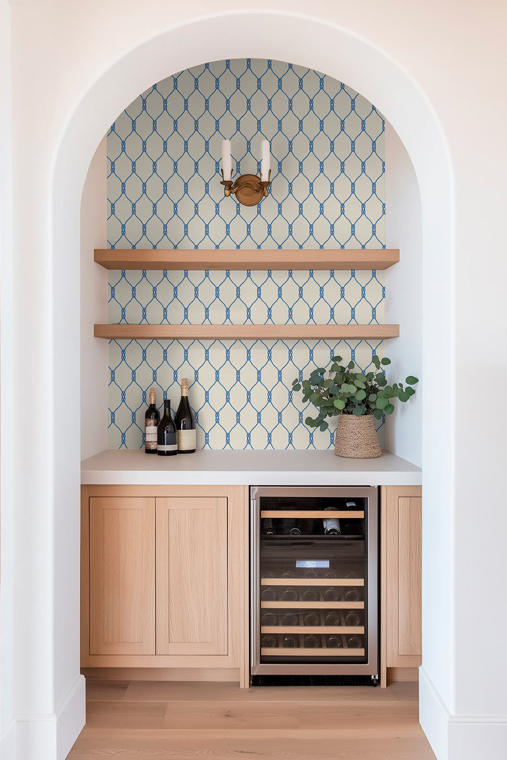 Performance vinyl wallpaper featuring a clean repeating rope-knot geometric pattern on a smooth, washable surface perfect for lake house kitchens and wet bars