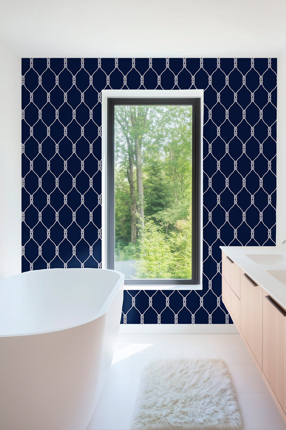 Performance vinyl wallpaper featuring a clean repeating rope-knot geometric pattern on a smooth, washable surface in classic nautical navy and white for bathrooms