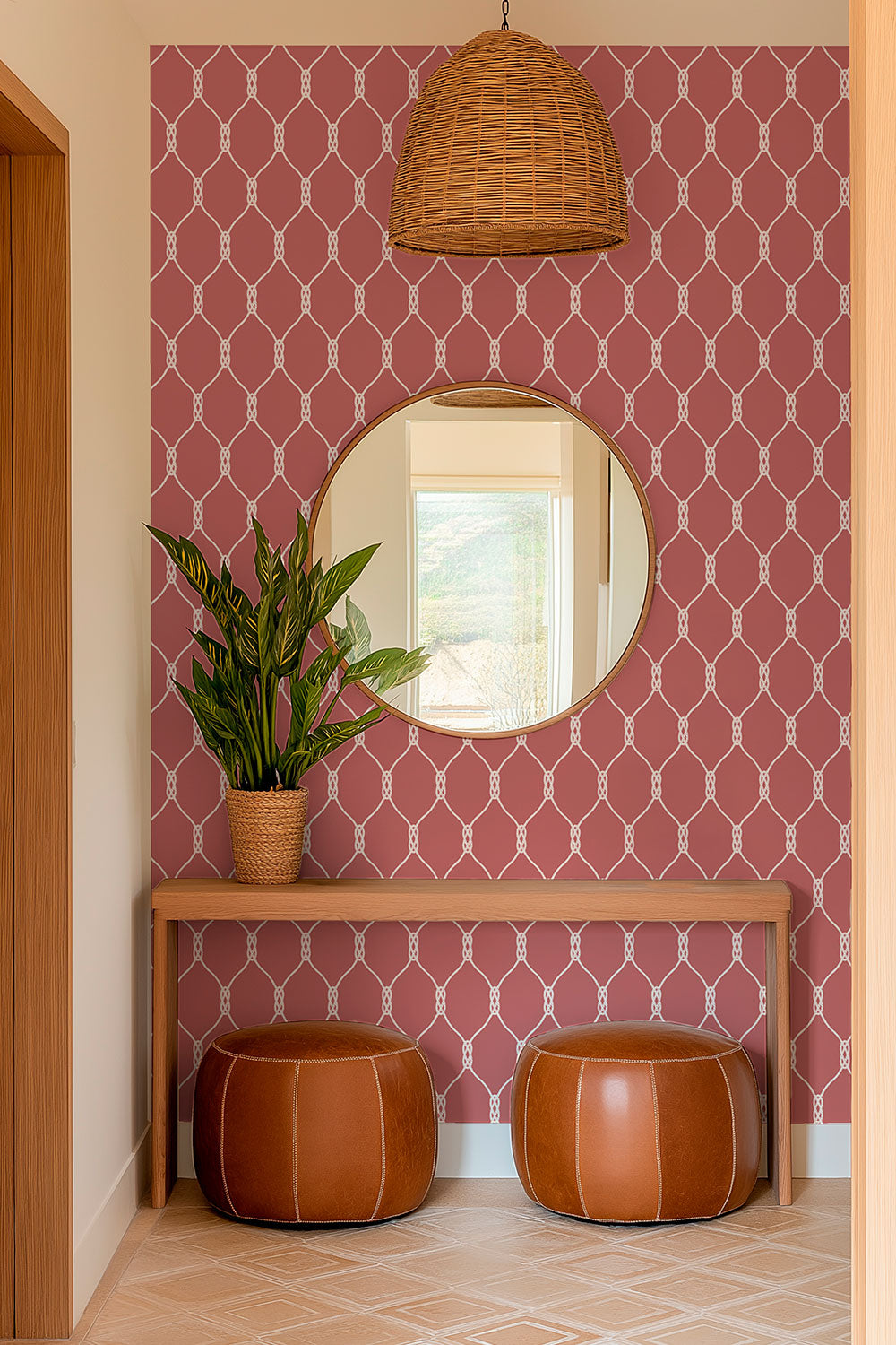 Performance vinyl wallpaper featuring a clean repeating rope-knot geometric pattern on a smooth, washable surface in classic preppy nantucket red, perfect for coastal cottage entryways