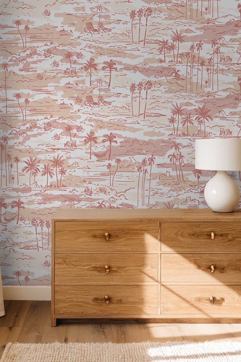 Seaside Soiree removable peel and stick wallpaper in Sunset Coral featuring watercolor palm trees, beach chairs, umbrellas, hammocks and tropical landscapes.
