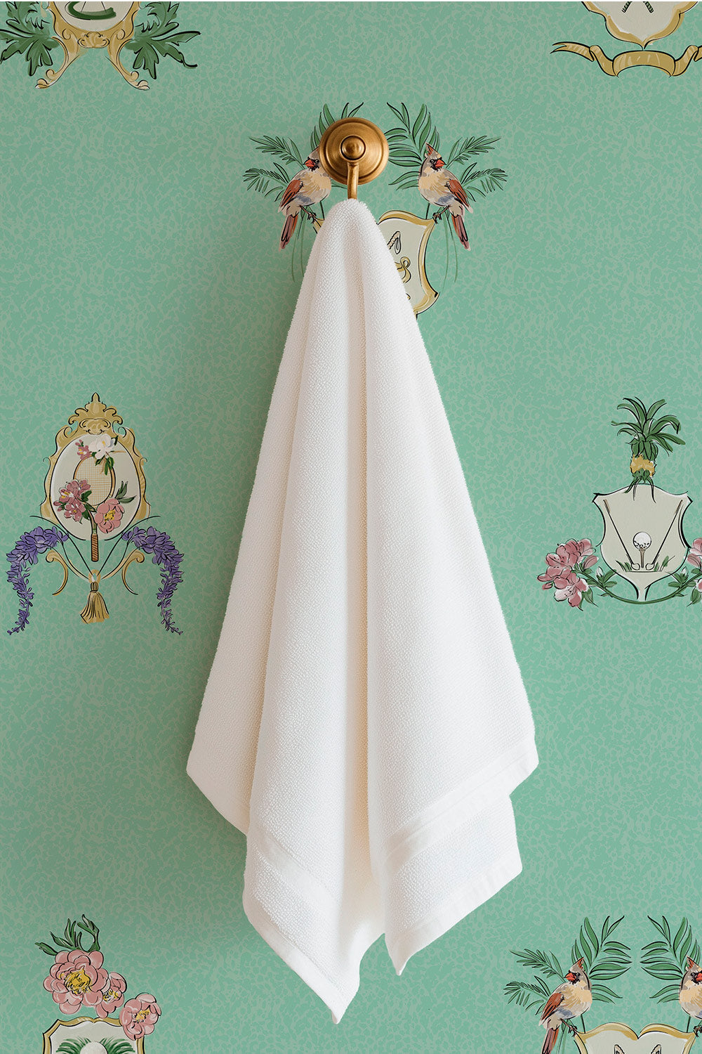 Country Club Crests washable performance vinyl wallpaper with tennis, golf and paddle crests, birds and florals on an aqua green background