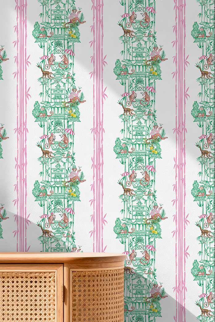 Chinoiserie Shenanigans removable peel and stick wallpaper in Bamboo Grove Green featuring playful monkeys, pagodas, porcelain vases and pink bamboo featured in this 