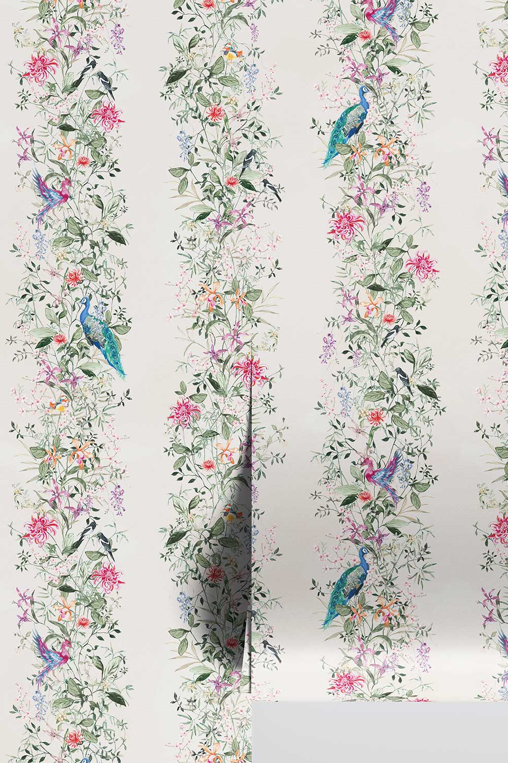 Hand-painted Mahjong Garden Stripe wallpaper featuring watercolor chinoiserie florals, peacocks, birds, bamboo, and botanical stripes on an off-white background.