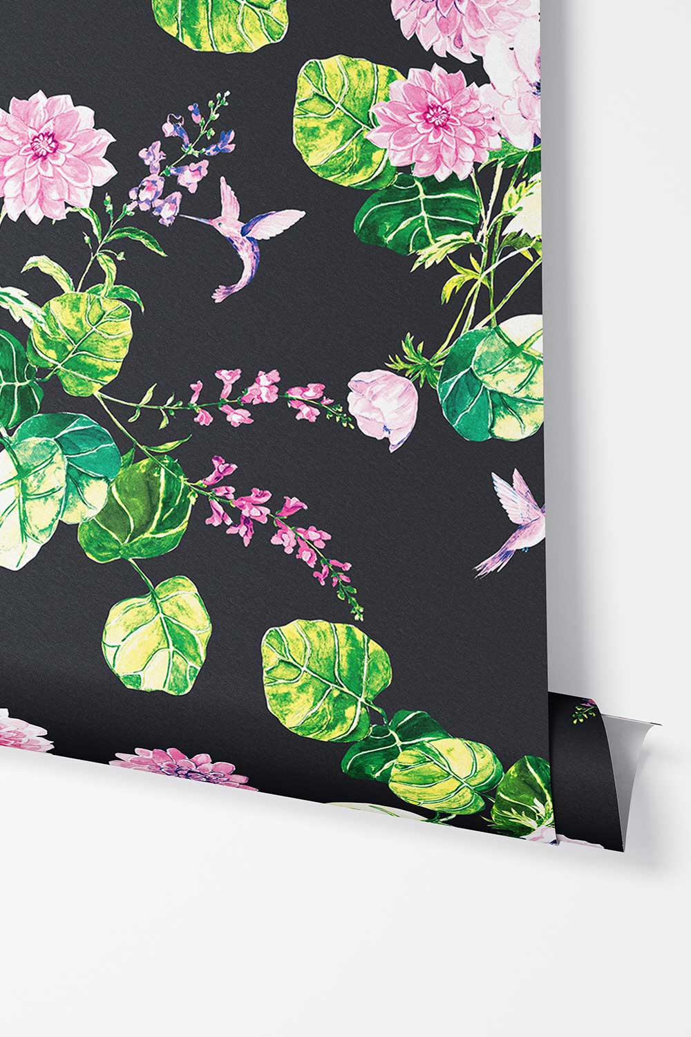 Chirp Society removable peel and stick wallpaper in Midnight Black featuring watercolor pink flowers, lush green leaves, hummingbirds and butterflies.