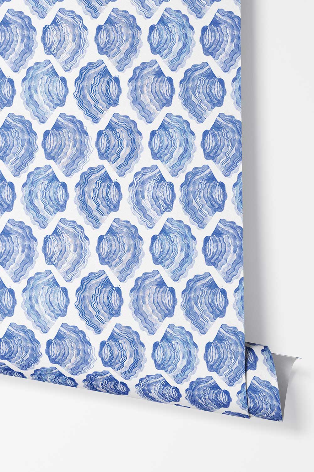 See Sells Sea Shells removable peel and stick wallpaper in Seaside Blue featuring rows of hand-painted blue and white watercolor oyster shells.