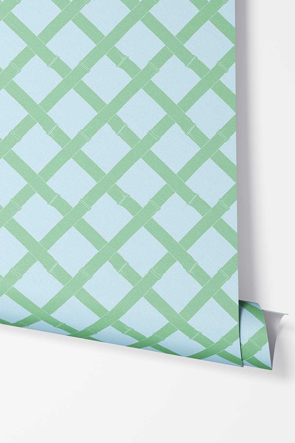 Tropicana Trellis removable peel and stick wallpaper in Cypress Garden featuring a geometric green bamboo lattice pattern on a soft light blue background.