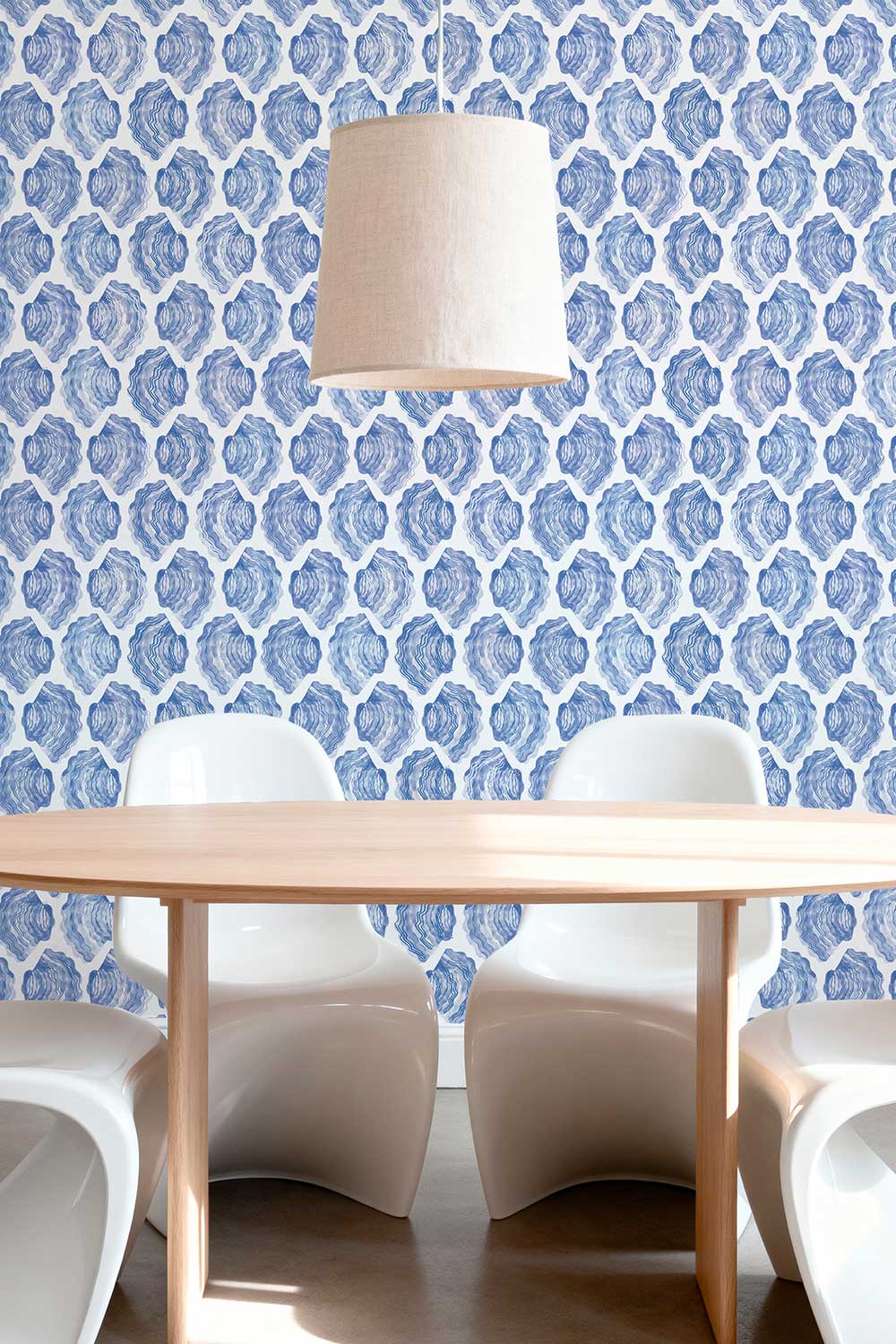 See Sells Sea Shells removable peel and stick wallpaper in Seaside Blue featuring rows of hand-painted blue and white watercolor oyster shells.