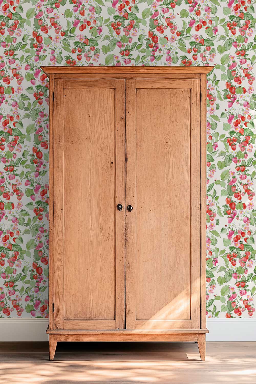 Strawberry Fields removable peel and stick wallpaper in Sun-Ripened Red featuring watercolor red and pink strawberries, blossoms, green leaves and tiny ladybugs.