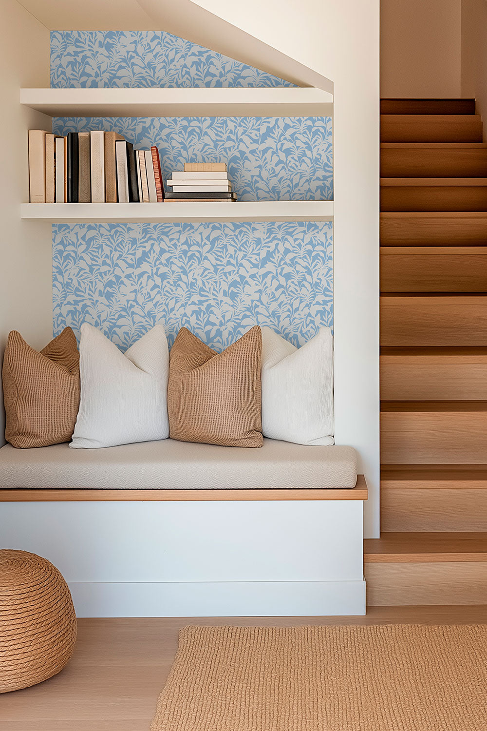 performance vinyl wall covering perfect for heavy use spaces like this reading nook seen here in a soft botanical french blue and white leaf pattern