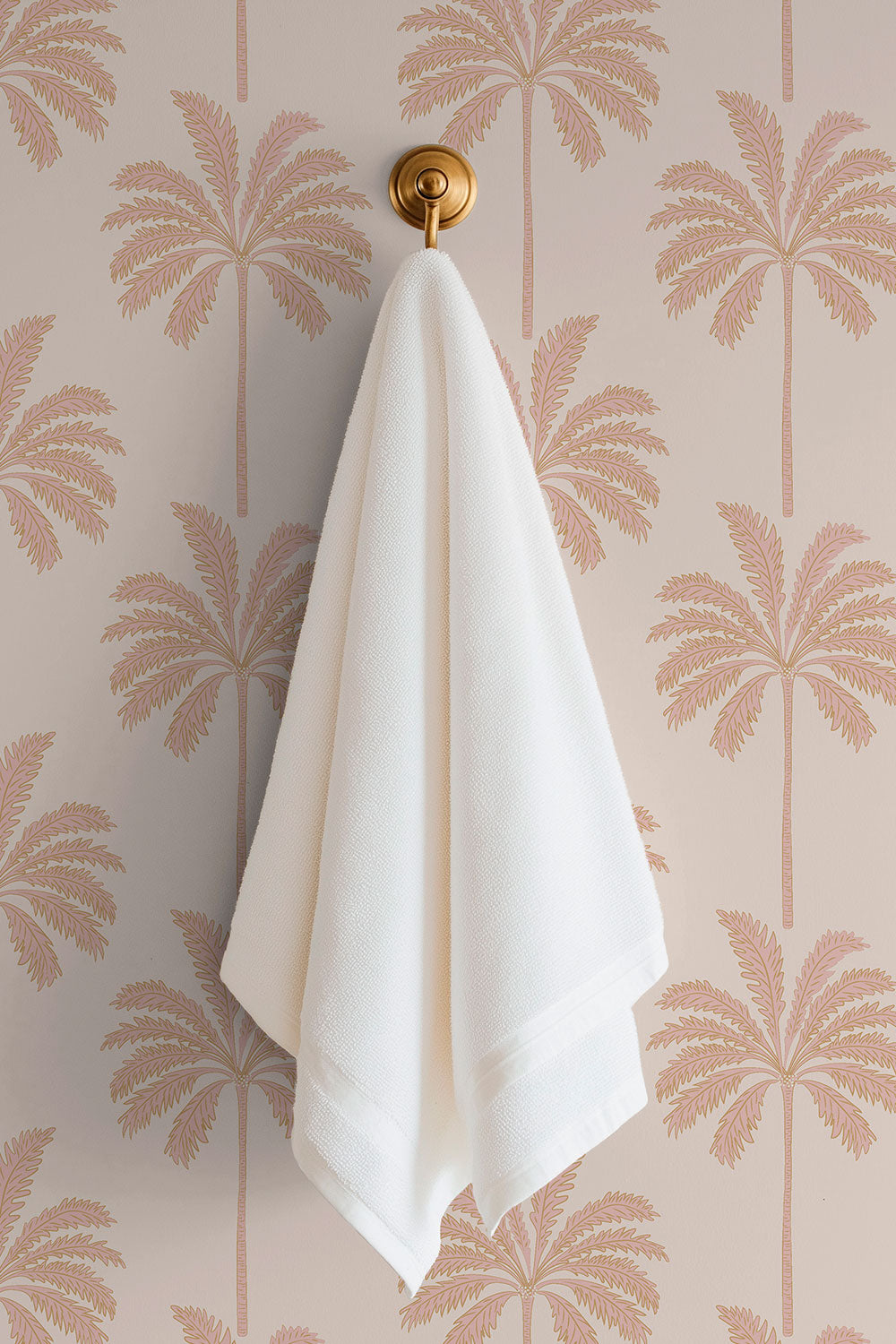 washable and stain resistant botanical palm tree striped wallpaper in performance vinyl, perfect for coastal beach houses and luxury vacation rental homes in neutral pink and peach