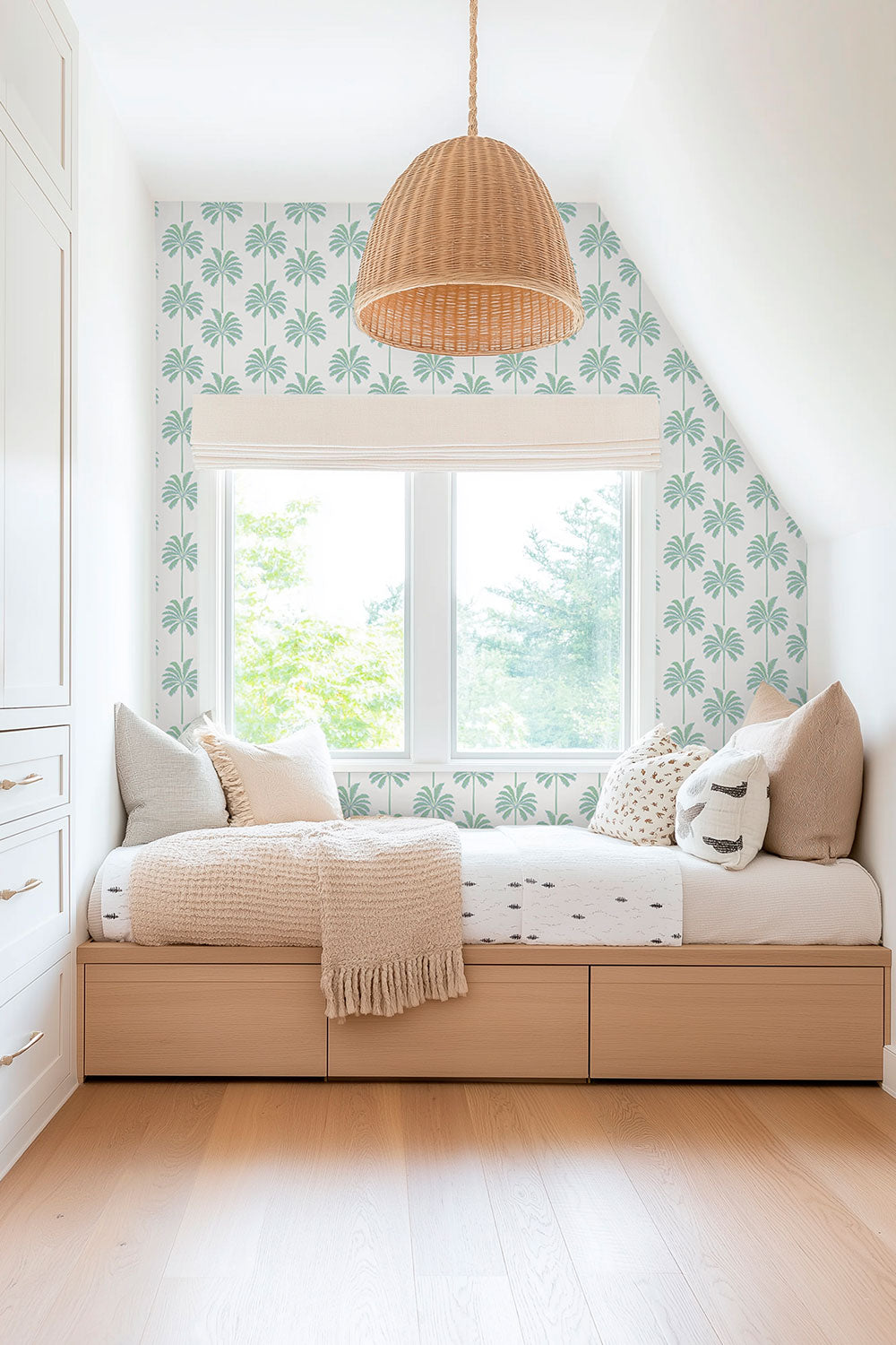 gender neutral coastal sleeping bedroom nook with peaceful palm tree striped wallpaper