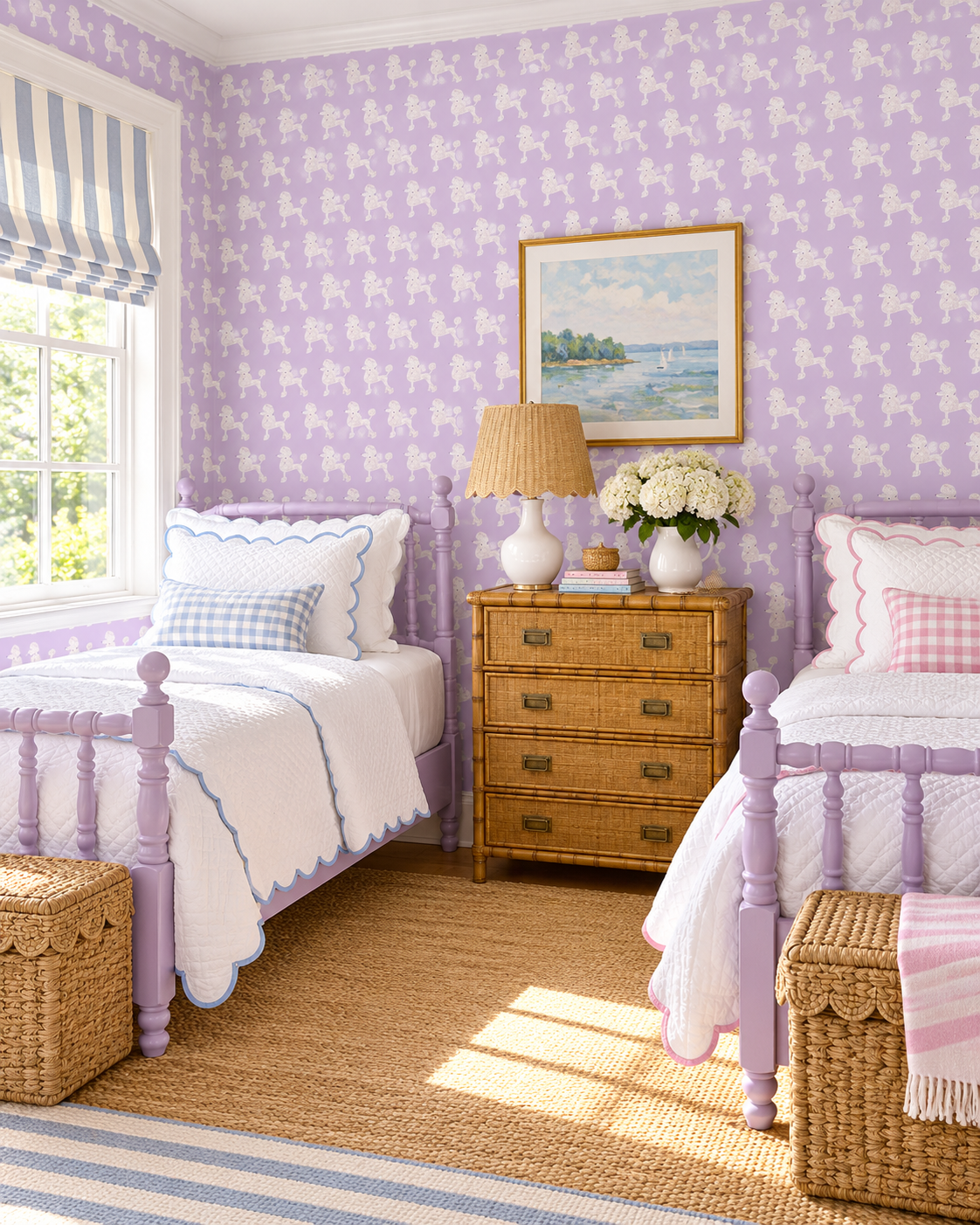 A beautifully styled children's bedroom featuring lavender and white patterned wallpaper, two matching lavender single beds with white bedding, a central wicker chest of drawers, and a natural jute rug. Poodle striped wallpaper on lavender with soft pink dogs