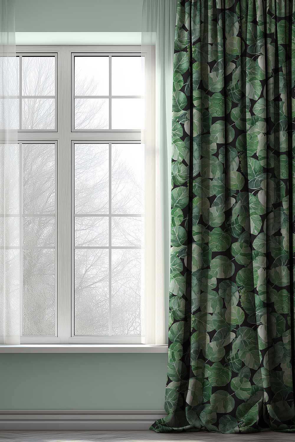 Coastal botanical upholstery fabric with oversized hand-painted sea grape leaves in layered watercolor greens on a light black base