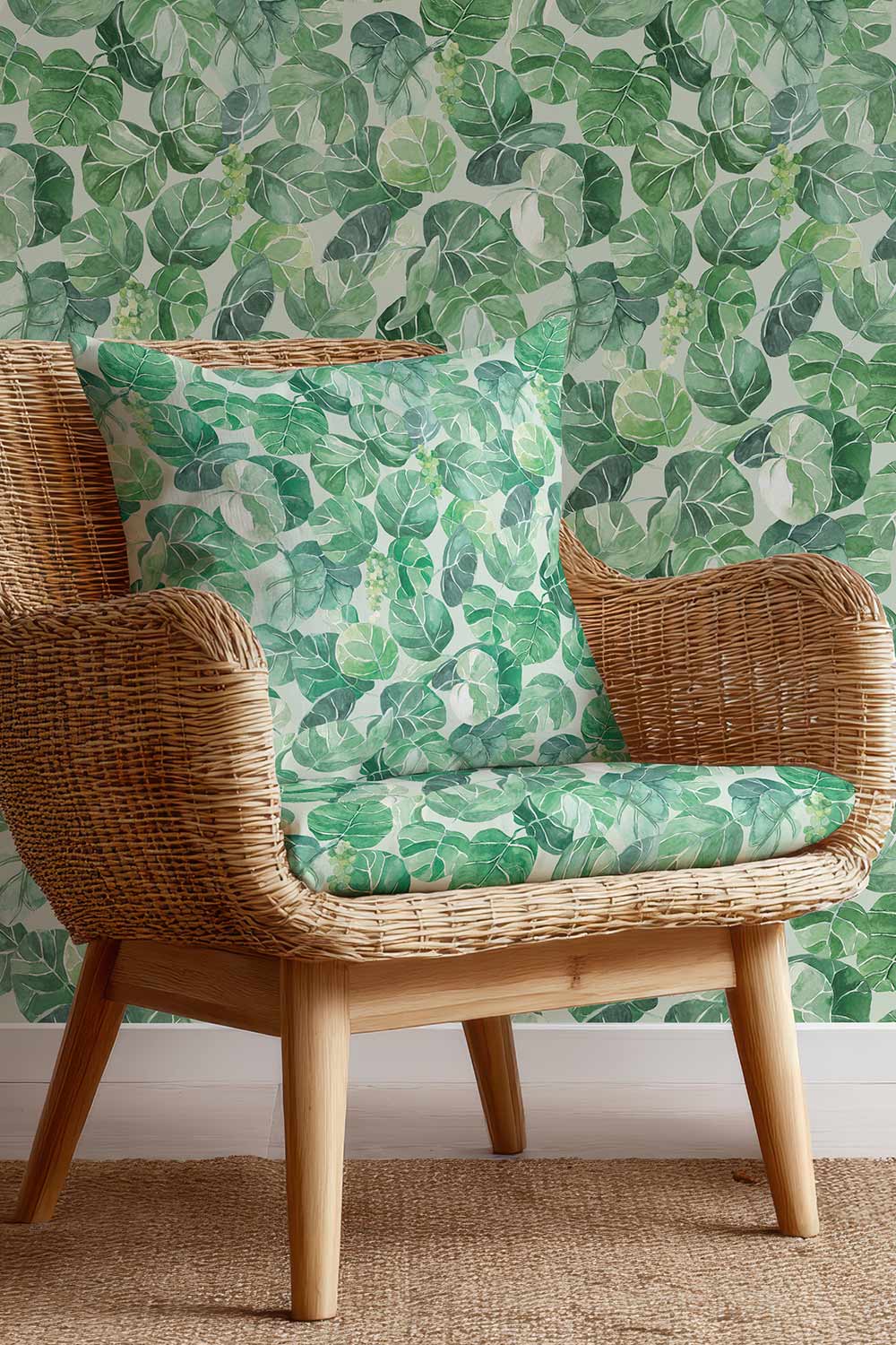 Coastal botanical upholstery fabric with oversized hand-painted sea grape leaves in layered watercolor greens on a light white base