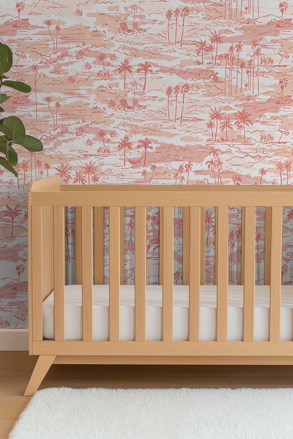 feminine baby girl coastal nursery with shades of pink beach inspired toile wall-covering