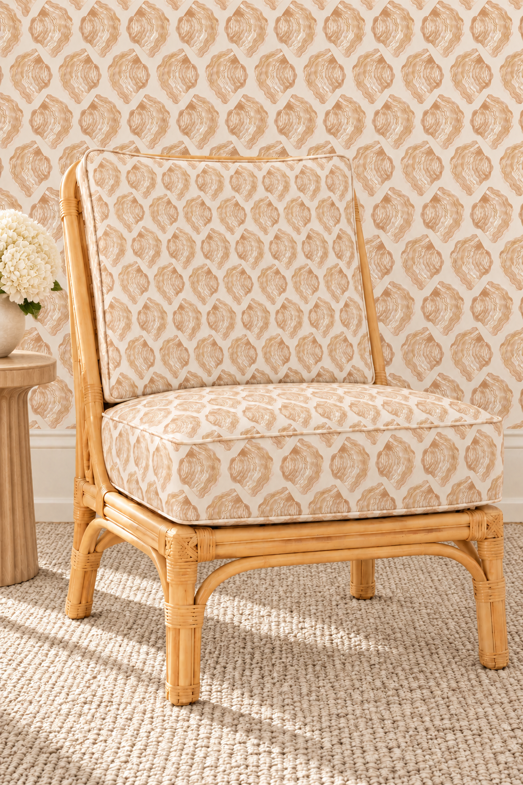 custom chair upholstery and coordinating wallpaper in coastal stripe upholstery fabric with hand-painted watercolor seashells arranged in a relaxed, beach-inspired pattern.