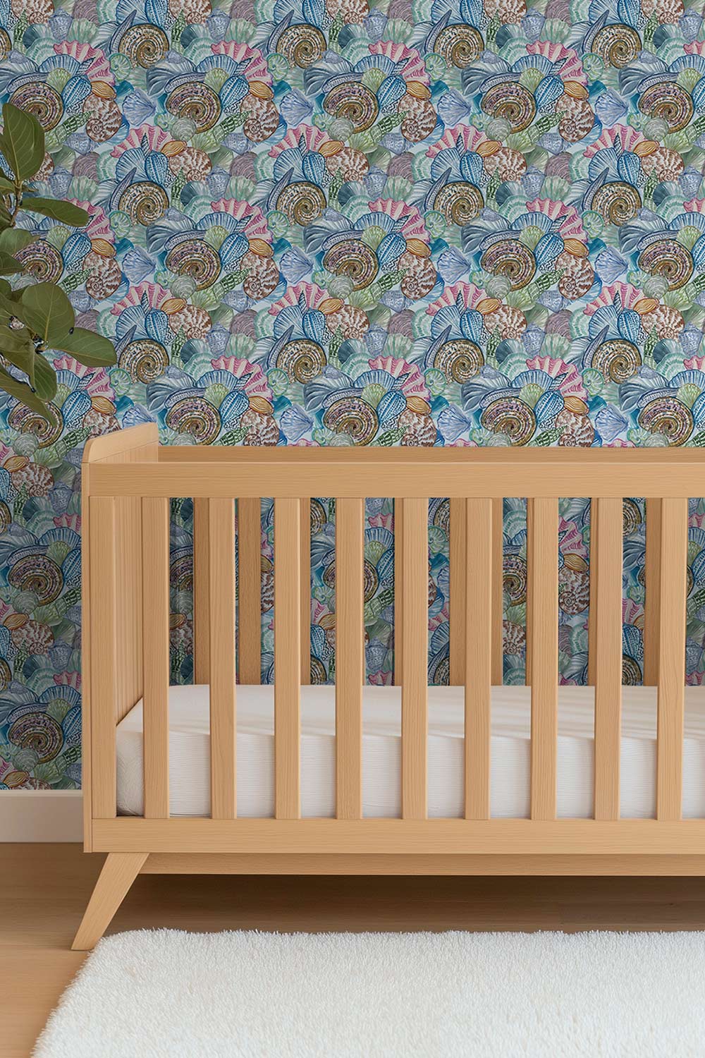 Watercolor seashell wallpaper featuring a colorful collage of hand-painted shells inspired by Atlantic beaches; shown in vibrant coastal tones perfect for coastal inspired gender neutral baby nurseries