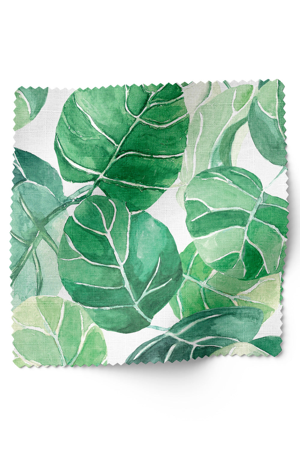 Tropical botanical upholstery fabric with large-scale hand-painted watercolor leaves in layered shades of green, inspired by coastal landscapes on white base.