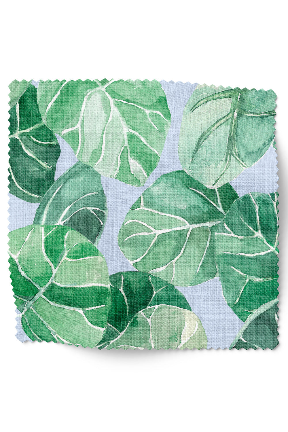Tropical botanical upholstery fabric with large-scale hand-painted watercolor leaves in layered shades of green, inspired by coastal landscapes on light french blue ground color.