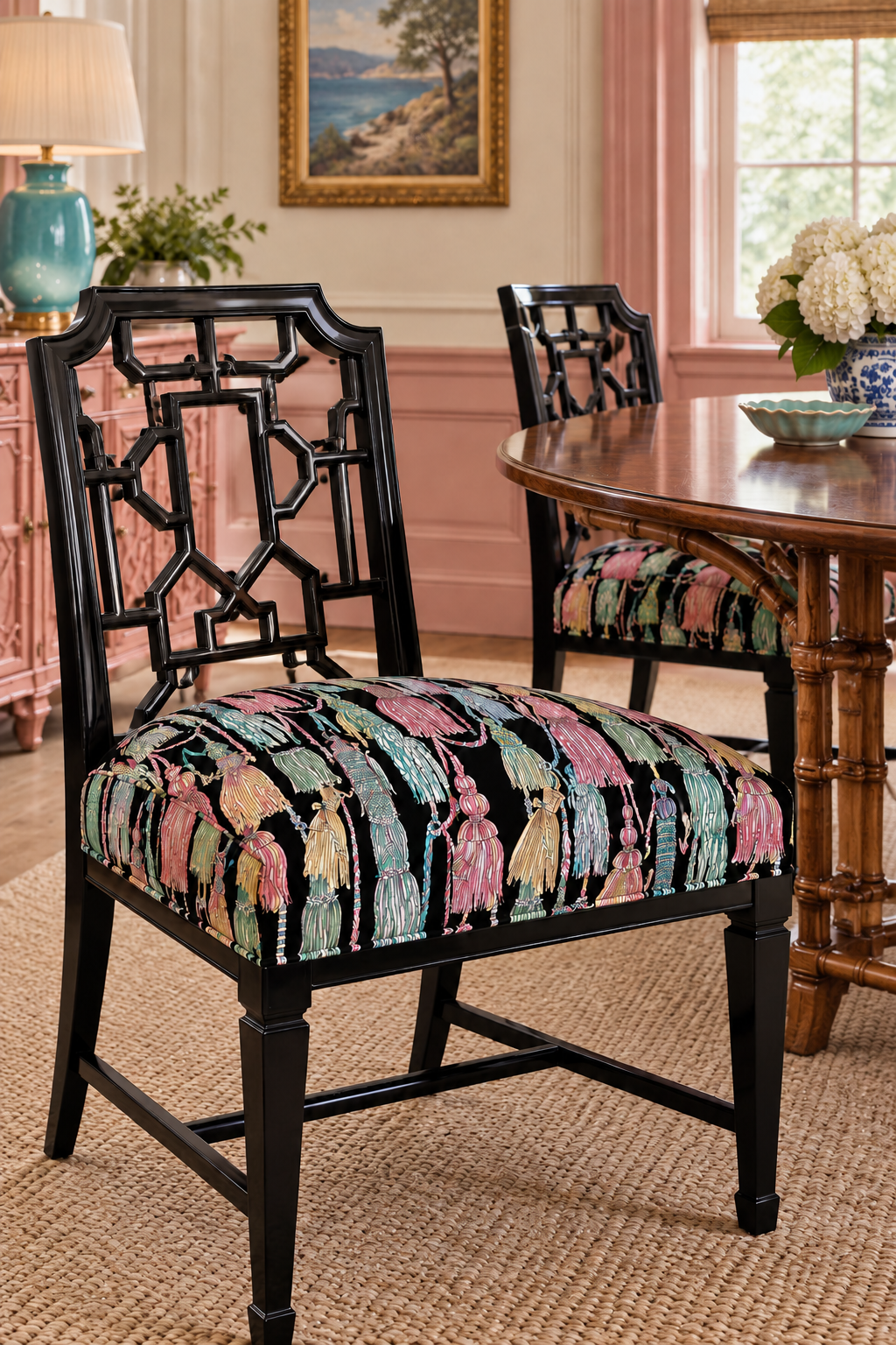 Custom dining room seat cushions featuring Decorative upholstery fabric with hand-painted watercolor tassels arranged in an allover trellis pattern, rich in texture and detail, black base with shades of pastel tassels. Chinoiserie style design.