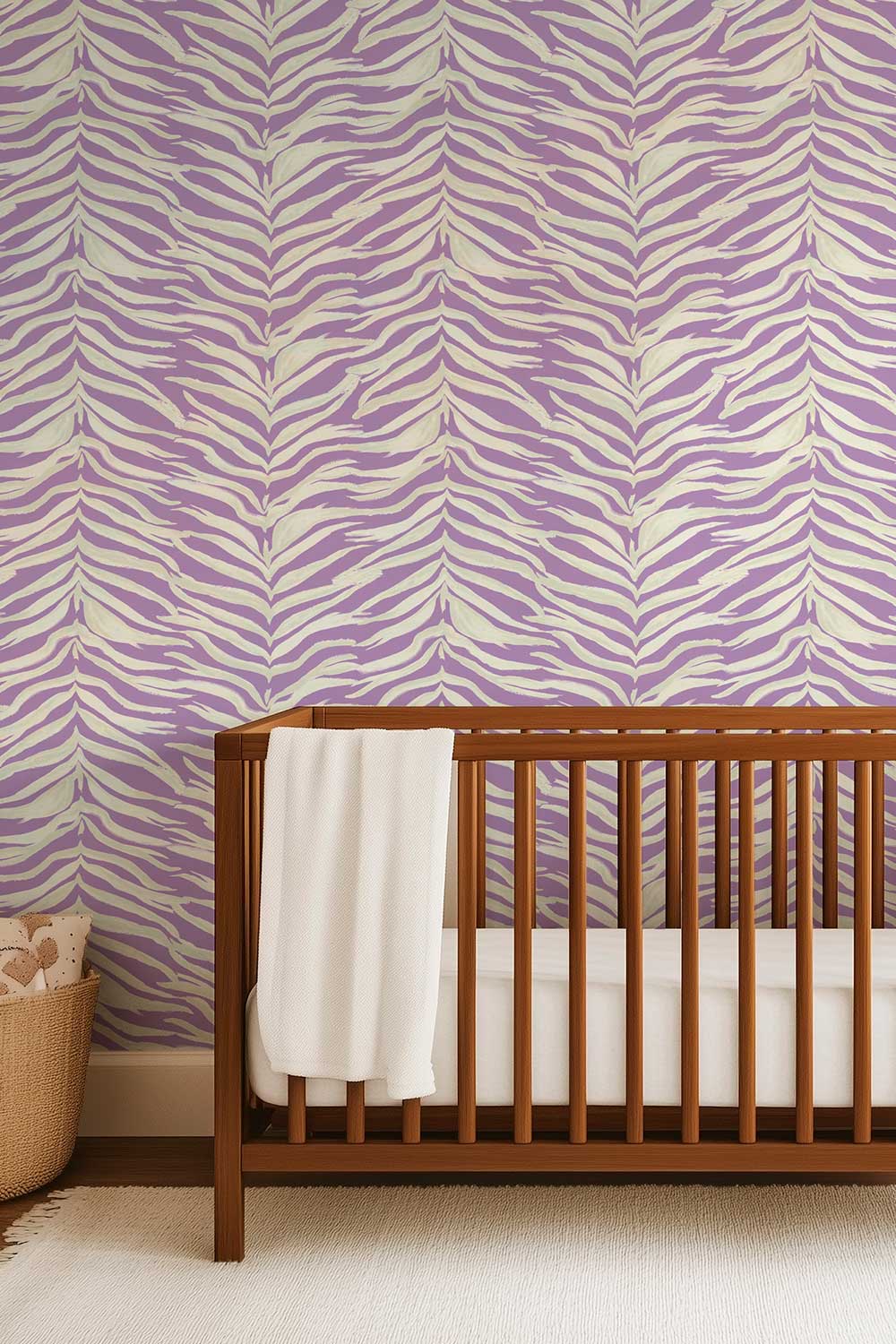 nursery with fun modern zebra stripe wall-covering in purple and white stripe