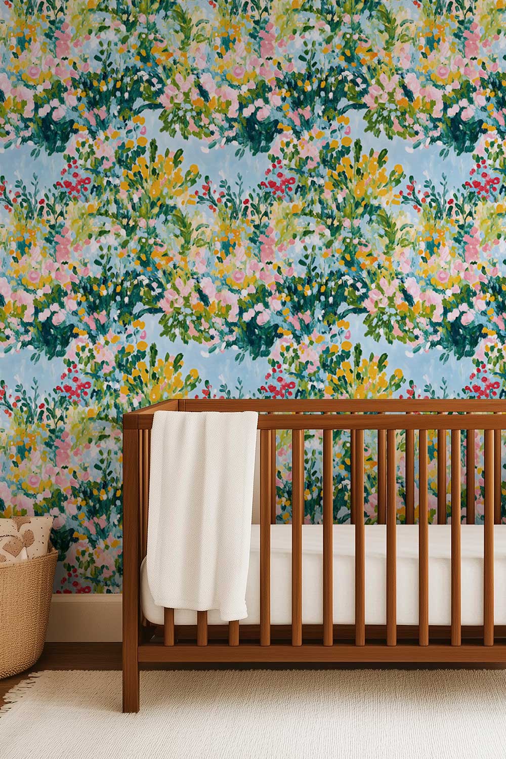 Painted floral luxury grass cloth wallpaper with layered garden blooms in pink, yellow, and green for feminine baby girl nursery