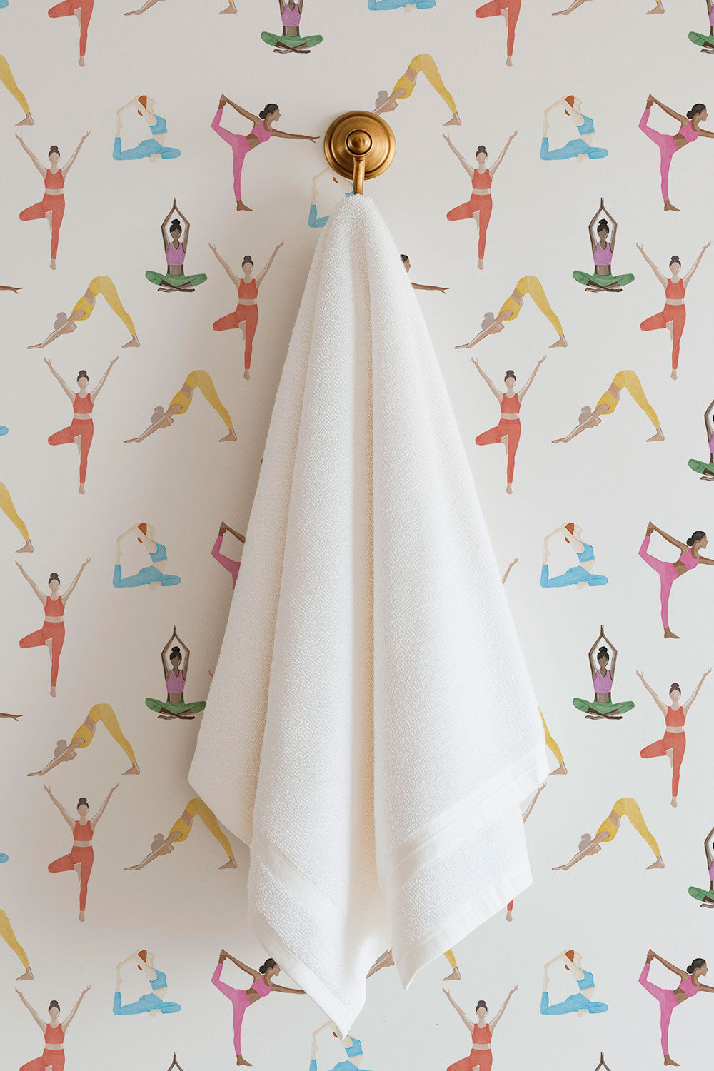 Textured commercial-grade vinyl wallpaper with watercolor yoga poses, arranged in an airy repeating pattern for gyms, wellness centers, and yoga studios.